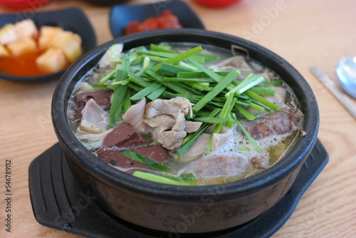 It is one of the representative foods of Korea, and it is eaten by boiling pork bones, cooking rice in the broth, and seasoning it. photo