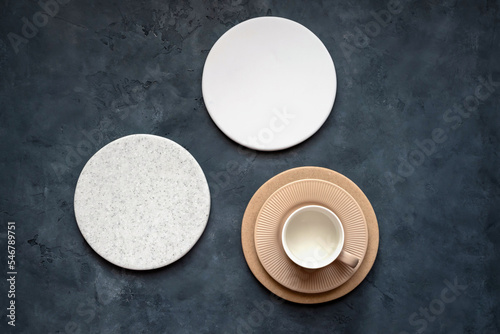 Round coasters made of artificial stone tabletop. Food stan.	Round supports made of artificial stone countertops. Grocery counter. View from above. Food mill.