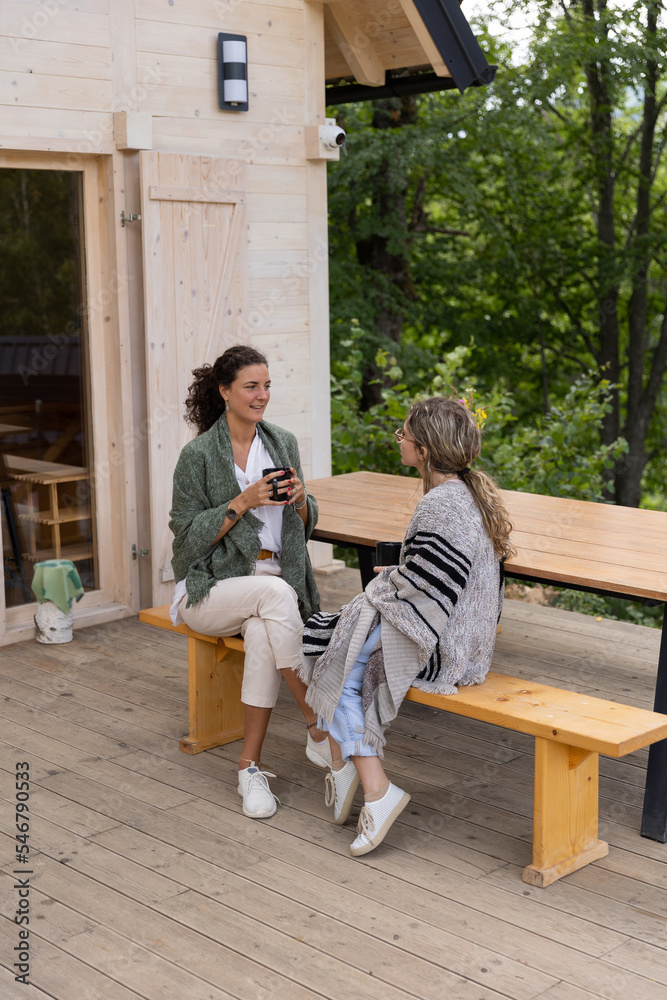 Two Friends Enjoying Their Morning Coffee Two Friends Enjoying Their Morning Coffee