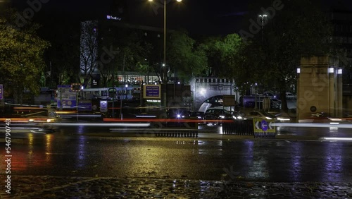 Time lapse shot of night time traffic at roundabout - Mersey Tunnel, Liverpool photo