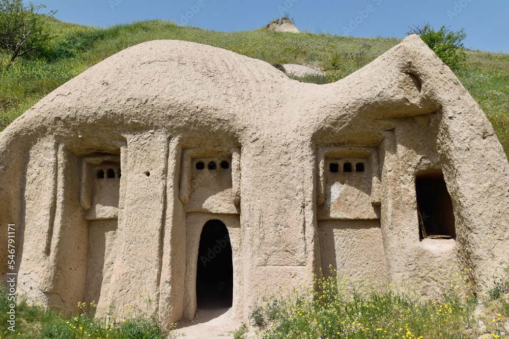 Close-up photo of ancient cave dwellings carved in stone at Goreme National Park, Cappadocia, Turkey