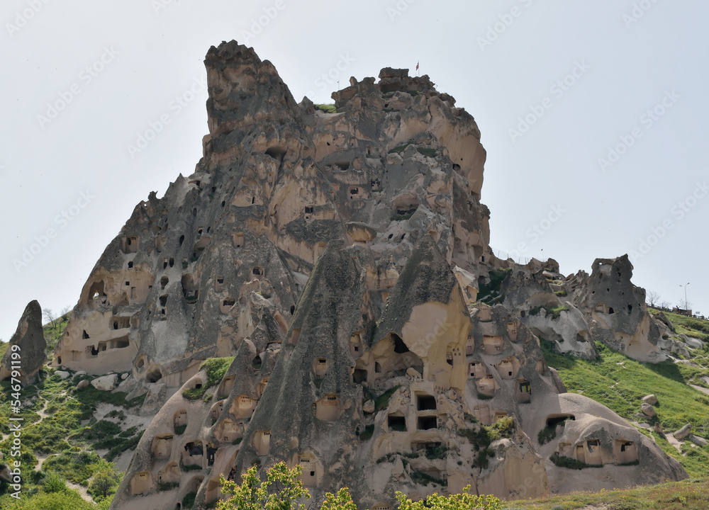 Low-angle view of ancient cave dwellings carved in stone at Goreme National Park, Cappadocia, Turkey