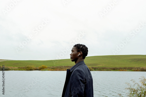 Portrait of a man listening to music in AirPods photo