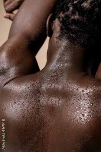 Wet back of a black man photo