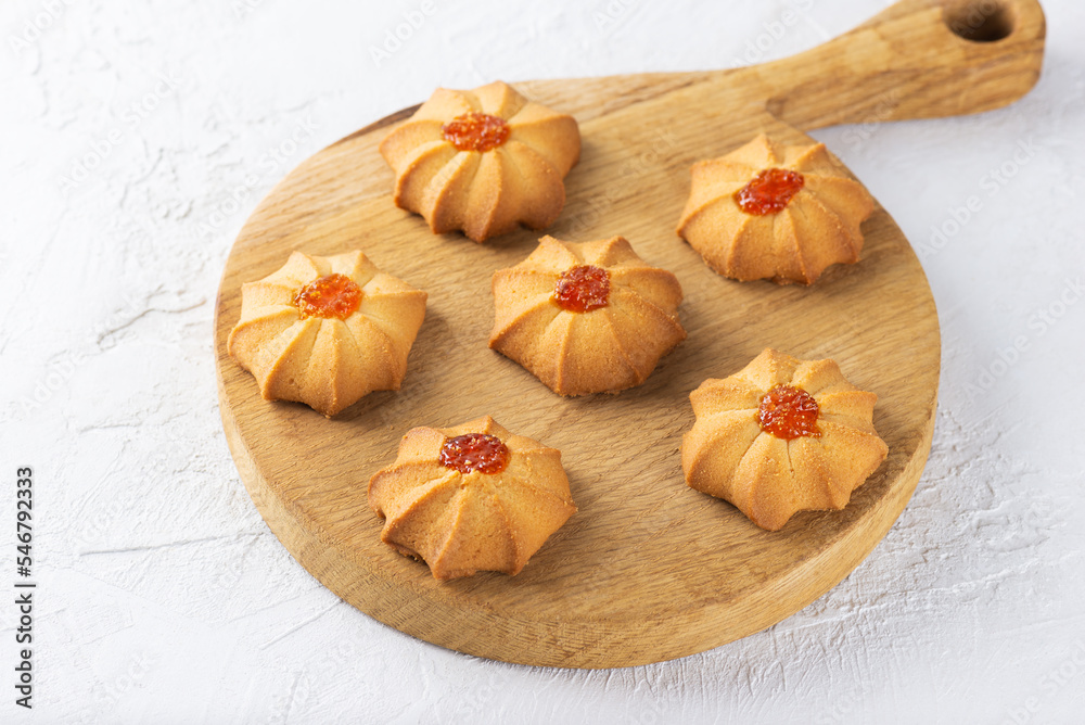 Shortbread kurabye. Sweet butter cookies for Chinese New Year on wooden board. 