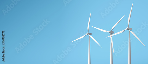 concept of green energy. Windmill or Wind turbine on blue background. 3d illustration © boommaval