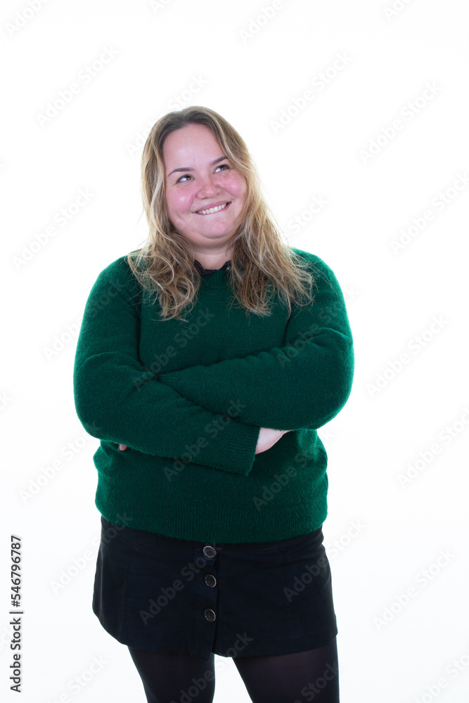 Curvy woman smiling with folded arms crossed smiling in white background Curvy woman smiling with folded arms crossed smiling in white background