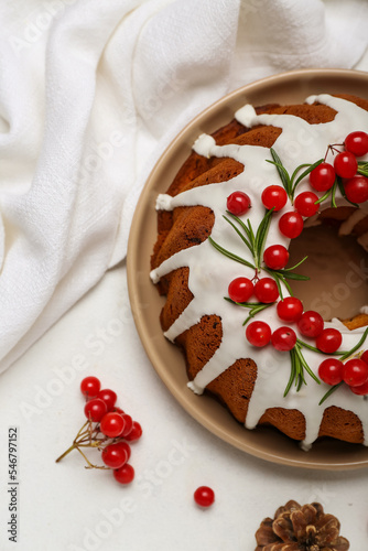 Tasty Christmas cake with cranberry on light background, closeup