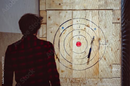 throwing axe for fun in a cage