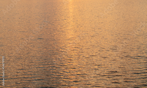 Golden expanse of water at sunset.