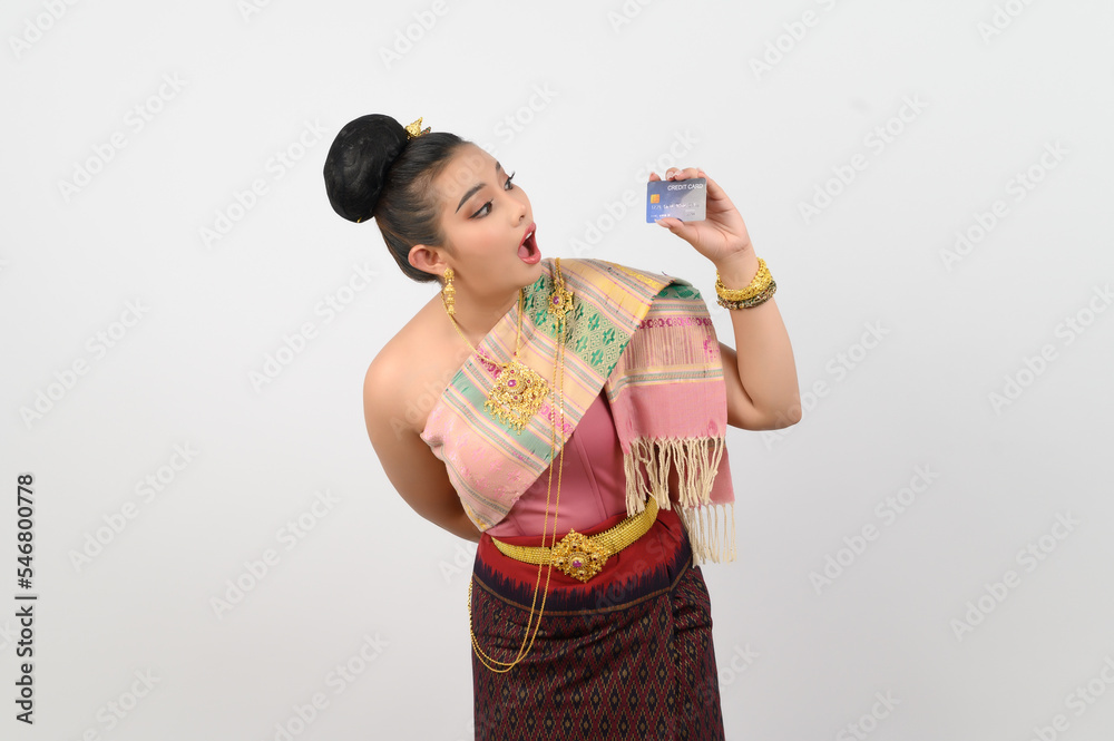 Portrait of Beautiful Thai Woman in Traditional Clothing Posing with credit card Portrait of Beautiful Thai Woman in Traditional Clothing Posing with credit card