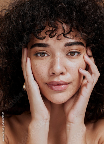 Beauty, portrait and natural face of black woman with healthy freckle skin texture touch. Aesthetic, facial and skincare cosmetic model girl touching cheeks for self love and wellness. photo