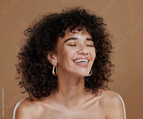 Beauty, wellness and face of woman with skincare glow from facial routine, natural makeup or self care treatment. Salon curly hair care, cosmetics and aesthetic model satisfied with luxury healthcare