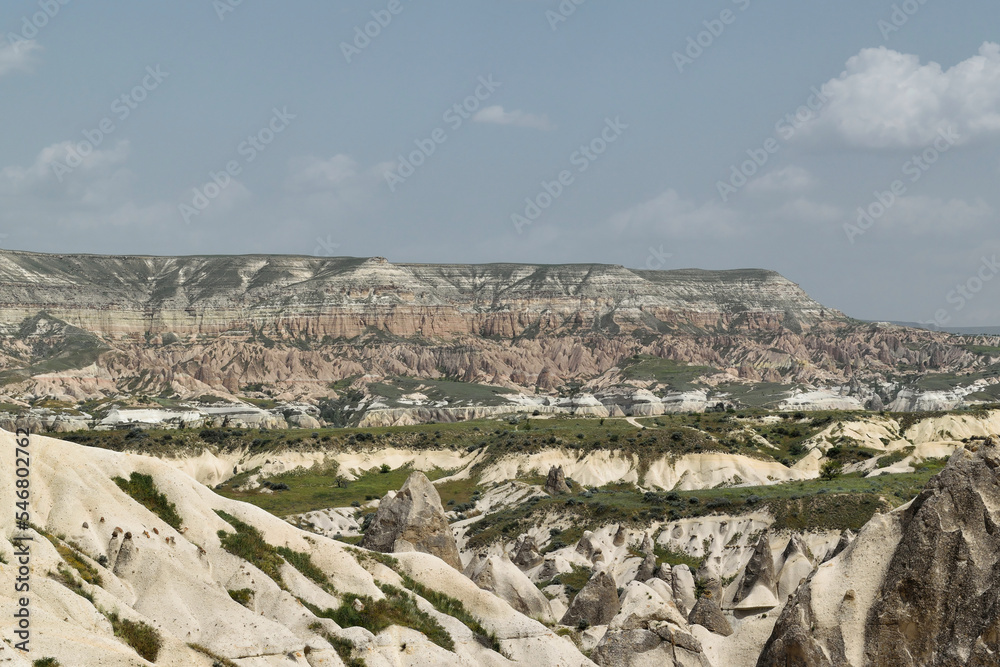 Panoramic view at Rose (red) Valley with mountains in the background at Goreme National Park, Cappadocia, Turkey