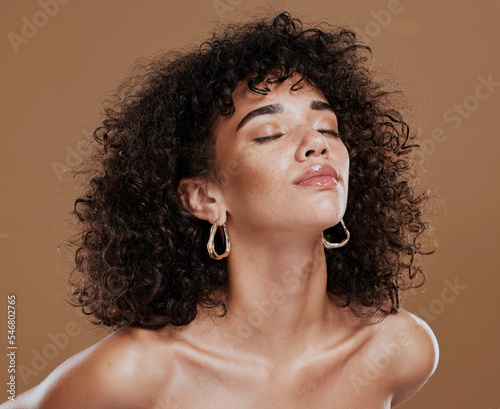 Beauty, skincare and portrait of elegant black woman model with cosmetics and afro hair style. Makeup, cosmetic glamour and a luxury skin care with beautiful face of African girl on studio background