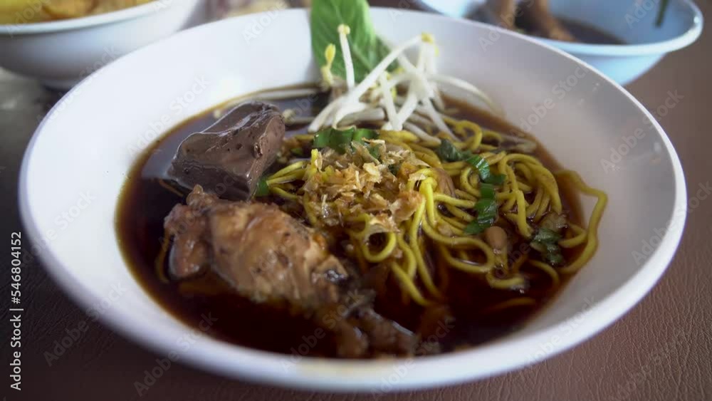Braised chicken wings chicken feet chicken blood bitter gourd noodle.food lunch.Bitter Gourd Chicken Noodle with Herb. Braised chicken wings chicken feet chicken blood bitter gourd noodle.food lunch.Bitter Gourd Chicken Noodle with Herb.