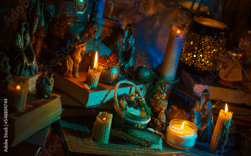 Illustration of magical stuff....candle light, magic wand, book of spells dark background, wizarding school, mystical aesthetic