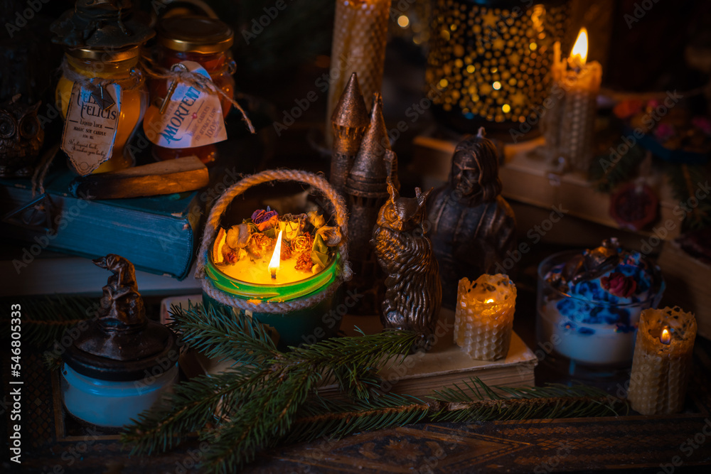 Illustration of magical stuff....candle light, magic wand, book of spells dark background, wizarding school, mystical aesthetic Illustration of magical stuff....candle light, magic wand, book of spells dark background, wizarding school, mystical aesthetic