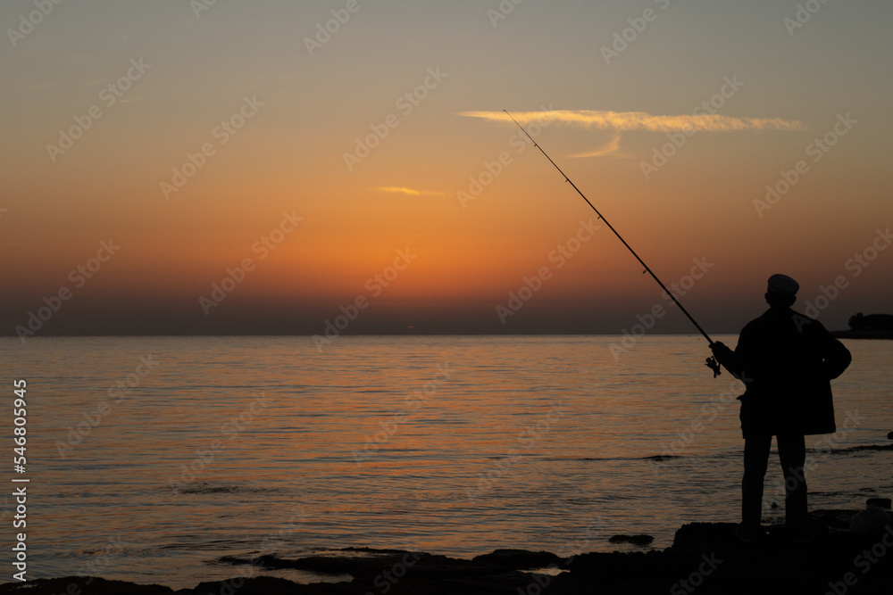 fishing at sunset