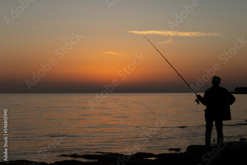 fishing at sunset © Julien Huber