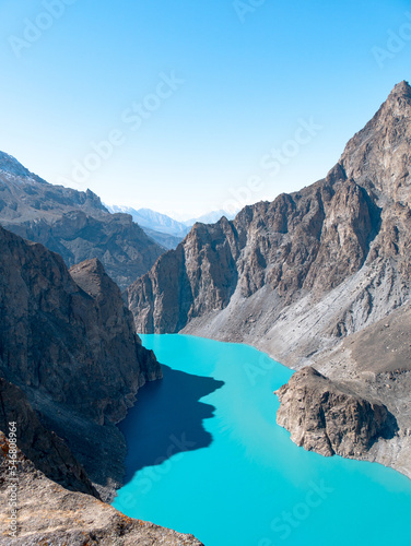Fototapeta Naklejka Na Ścianę i Meble -  Scenery at Attabad Lake in the Pakistani-Administered Kashmir Region of Gilgit-Baltistan on a sunny morning - Vertical shot