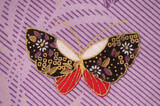 Butterfly pattern part of the old japanese fabric pattern on purple background.