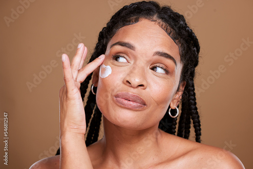Картината върху платно Black woman, skincare and facial moisturizer for beauty cream, makeup or cosmetics against a brown studio background