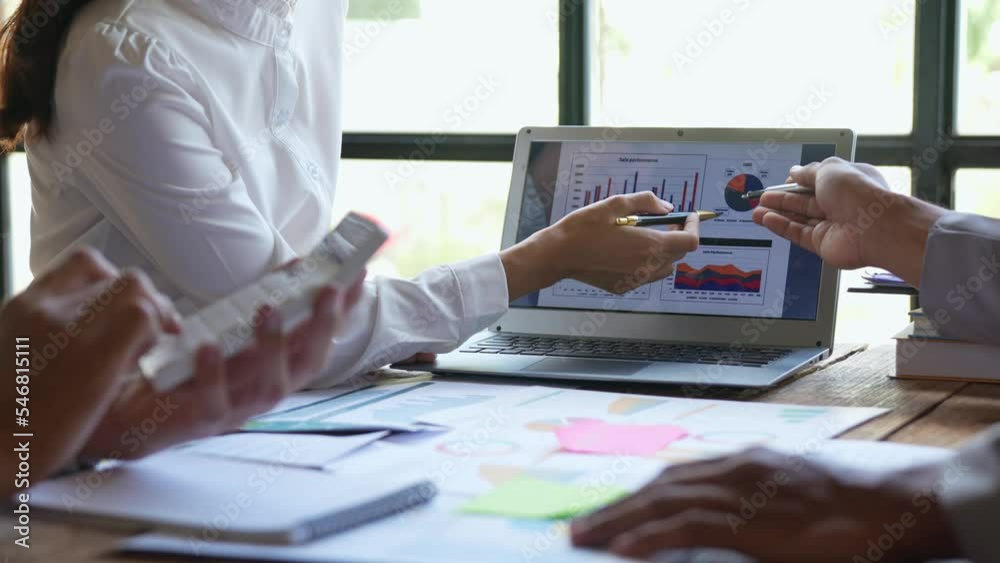 Business People Meeting using laptop computer,calculator,notebook,stock market chart paper for analysis Plans to improve quality next month. finance and analysis concept Business People Meeting using laptop computer,calculator,notebook,stock market chart paper for analysis Plans to improve quality next month. finance and analysis concept