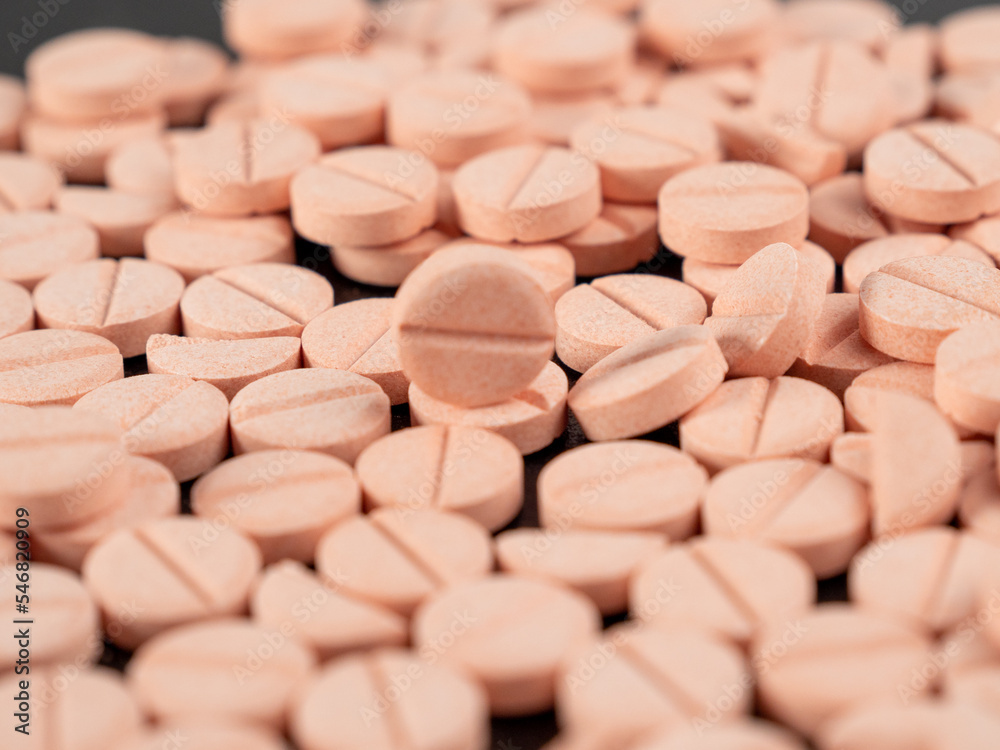 Lots of pink pills. Background from pink pills. medicine in tablets. Lots of pink pills. Background from pink pills. medicine in tablets.