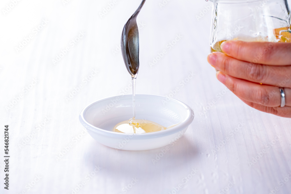 Honey dripping from spoon.
Sweet honey image.
Honey dripping from spoon.
Sweet honey image.