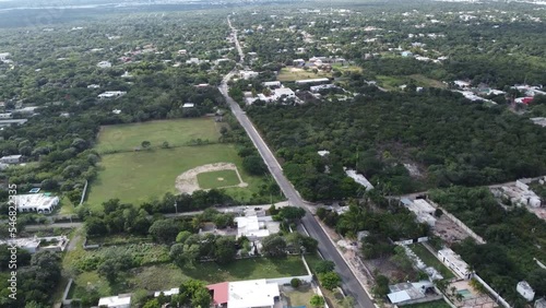 dron sobre carretera de pueblo en merida yucatan meico bonito inversion tererrenos photo