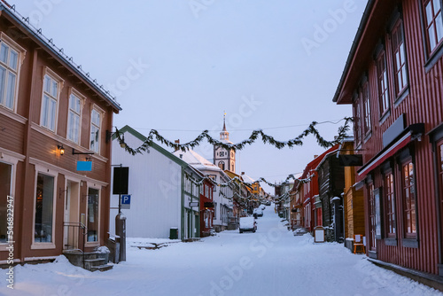 Street with wooden buildings in the town Roeros, Norway photo