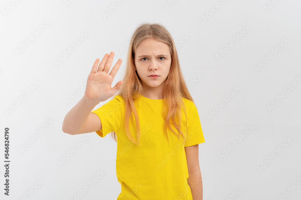 Stop, get away from me, back off. Portrait of afraid teen girl stretching out hands in defense, blocking something, standing over white background Stop, get away from me, back off. Portrait of afraid teen girl stretching out hands in defense, blocking something, standing over white background