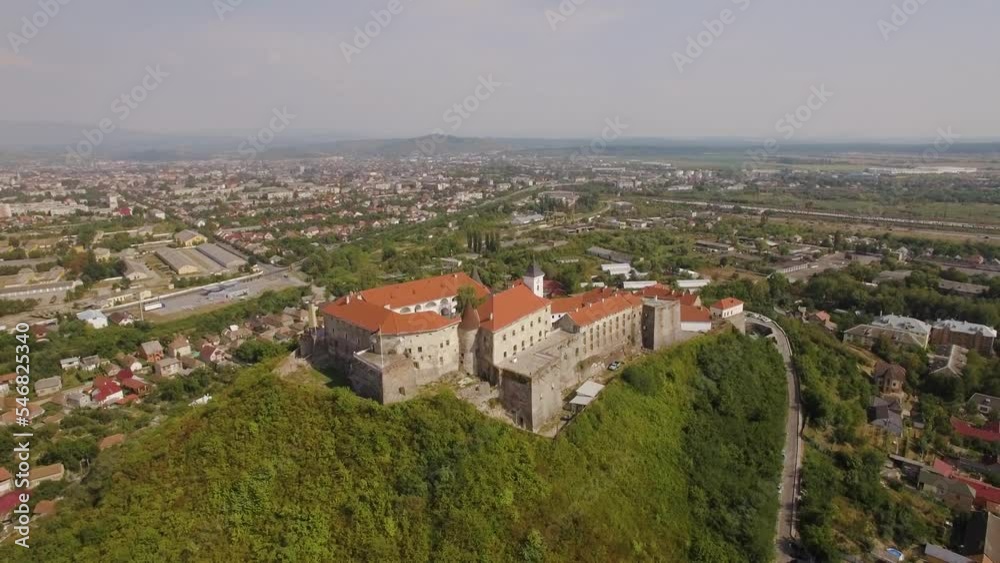 Castle of Palanok medieval fortress on a hill in Mykachevo, aerial view shot Castle of Palanok medieval fortress on a hill in Mykachevo, aerial view shot
