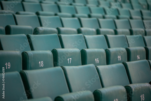 The empty seats of the stadium await match day