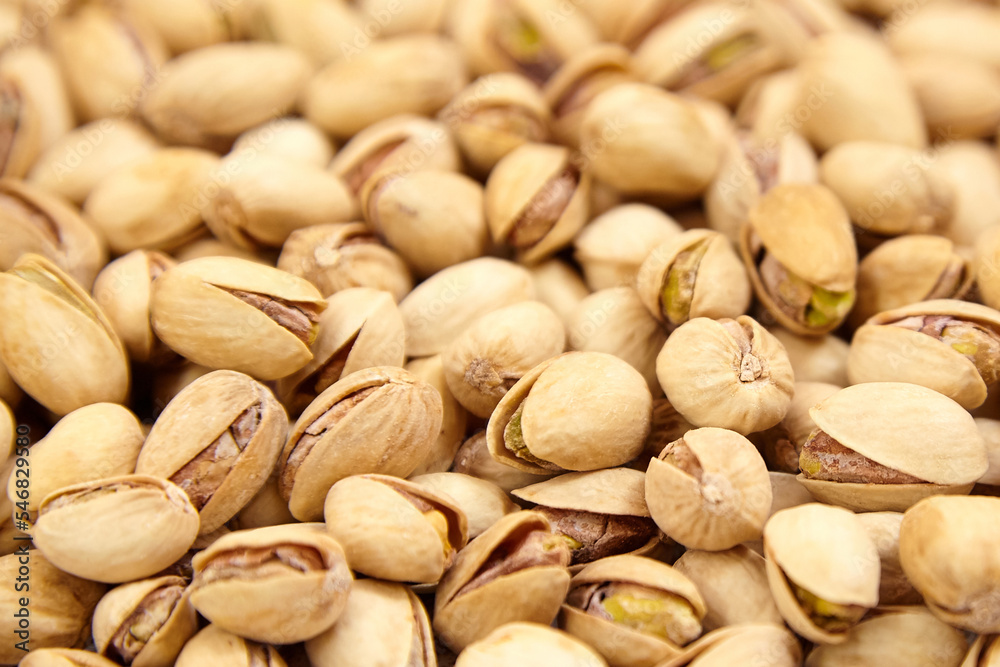 Pistachios as food background. Pistachio nuts, soft focus