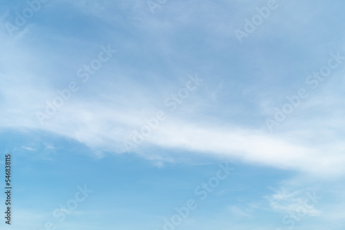 Beautiful blue sky bright midday sun with fluffy clouds. Summer sunshine with white cloudscape background. Natural scenic sunny day horizon sky wallpaper backdrop.