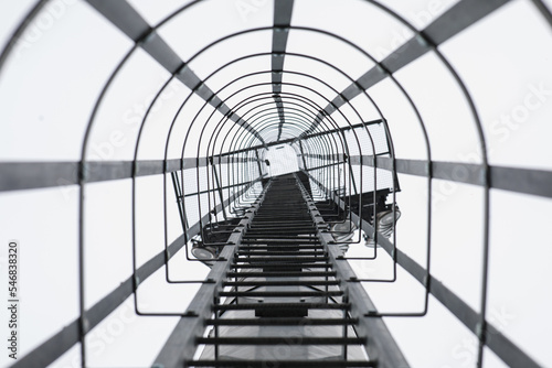 Stairs on a pole for climbing to the field for maintenance. Selective focus