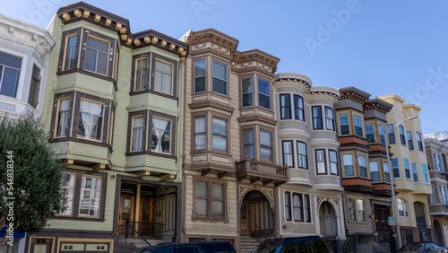 Beautiful Victorian houses painted in multiple colors on a street in the city of San Francisco, California, USA