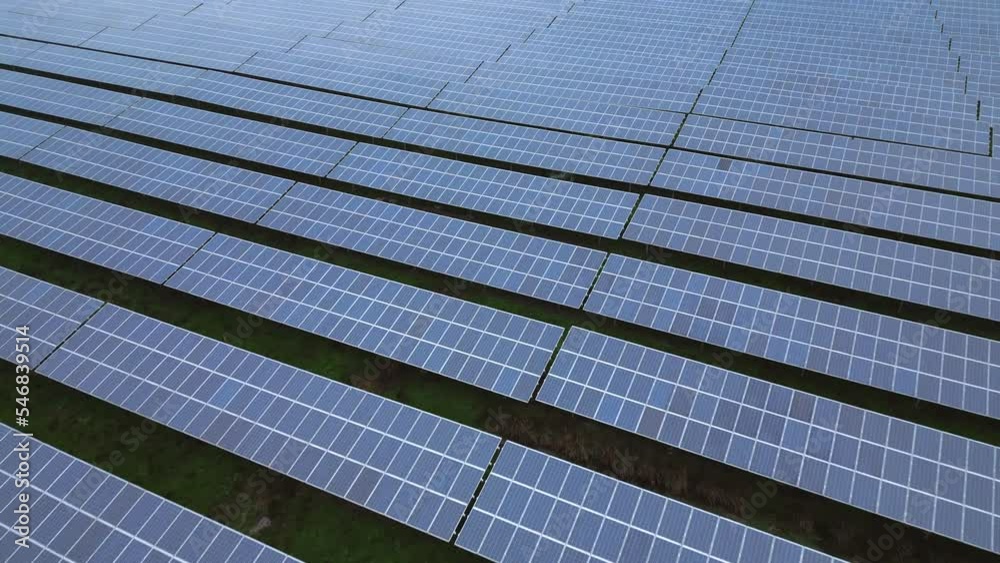 Solar panels of a solar park, endless pattern, slow drone flight Solar panels of a solar park, endless pattern, slow drone flight
