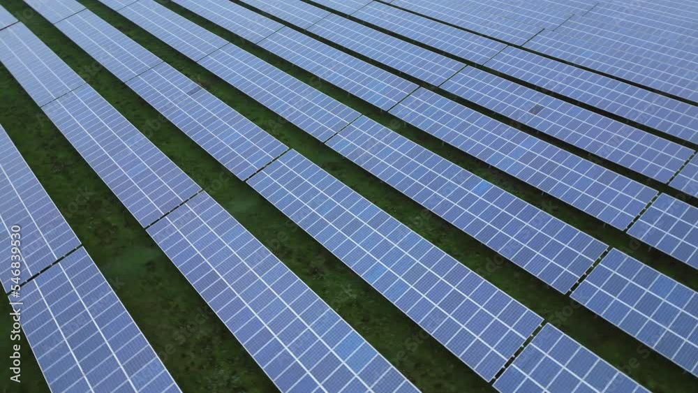 Solar panels in a solar park, orbiting drone shot, 360 view Solar panels in a solar park, orbiting drone shot, 360 view