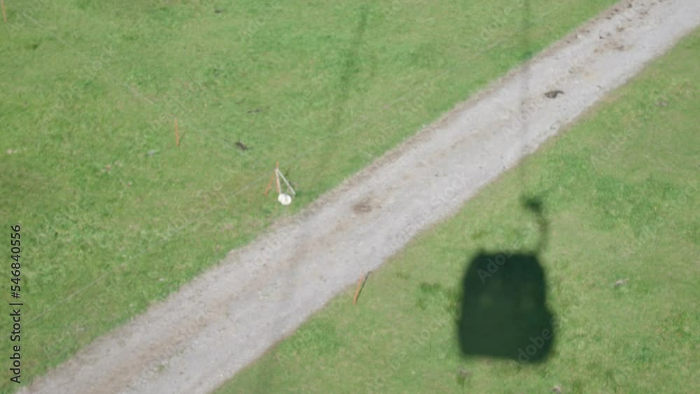 View from cable car of moving shadow on ground. View from cable car of moving shadow on ground.