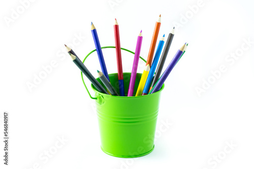 Color bucket with multicolor pencils, isolated on white background