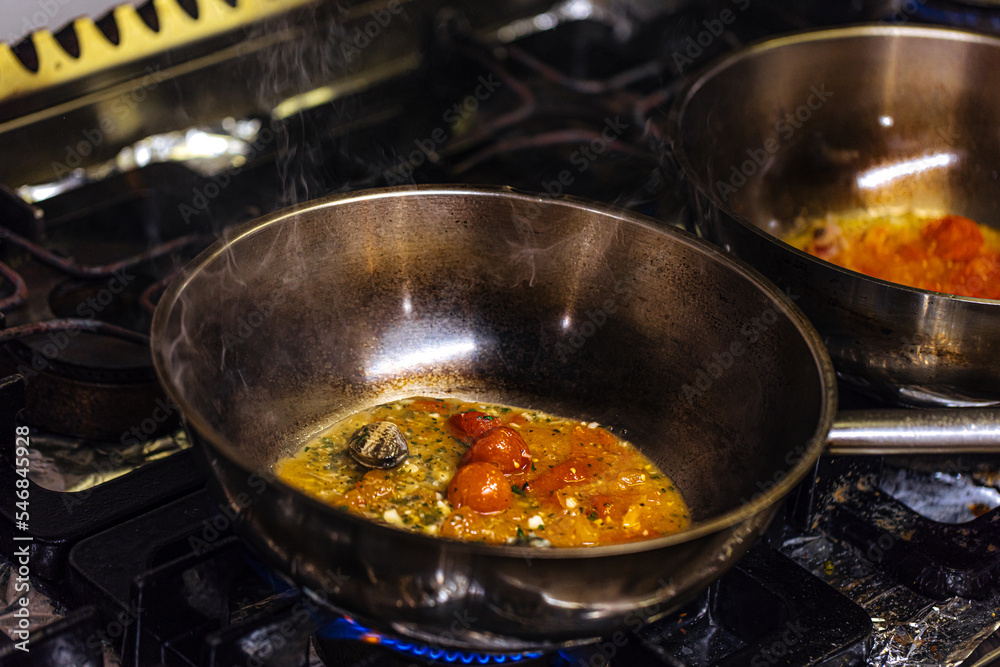 cooking pot with vegetables on the stove in the restaurant kitchen cooking pot with vegetables on the stove in the restaurant kitchen