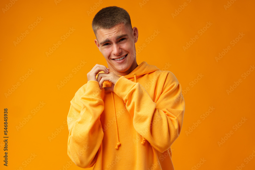 Young handsome man nervous and scared over yellow background. Young handsome man nervous and scared over yellow background.