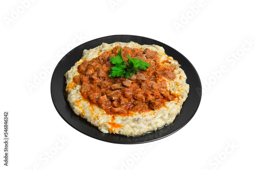 Sultans Delight from Ottoman Cuisine. Lamb Stew Served on a Bed of Aubergine Puree . Turkish Food Hunkar Begendi isolated white background