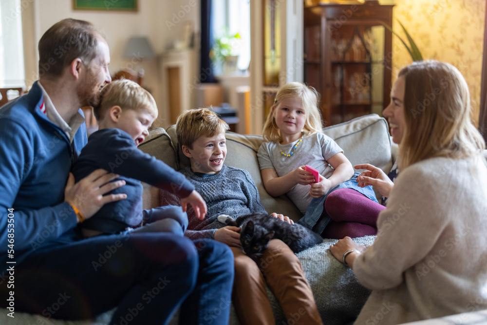 Happy young family having good time together at home
