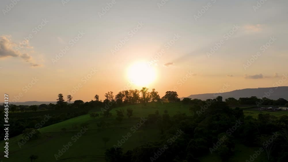 Sunset at rural life scenery. Rural landscape. Forest trees. Sunlight at scenic forest trees. Sunset sky. Sunset landscape. Colorful sunset skyline. Sunset at rural life scenery. Rural landscape. Forest trees. Sunlight at scenic forest trees. Sunset sky. Sunset landscape. Colorful sunset skyline.