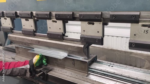 Automated Metal folding and Bending Machine. Manufacturing Process. Precise Machining. Close up