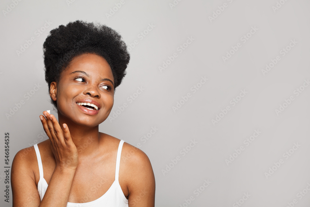 Happy young woman with fresh glowing skin, showing beautiful white smile. Beauty, cosmetology and skin care concept Happy young woman with fresh glowing skin, showing beautiful white smile. Beauty, cosmetology and skin care concept